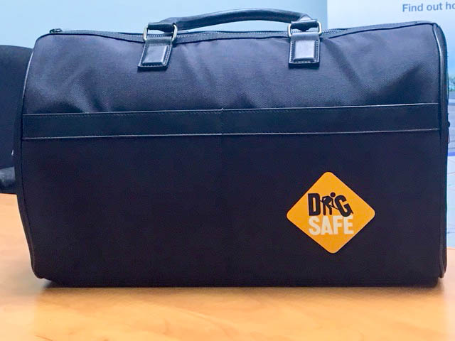 Informative Image showcasing the Dig Safe black canvas tote bag gifted to participants at the 2018 ORCGA Damage Prevention Symposium.