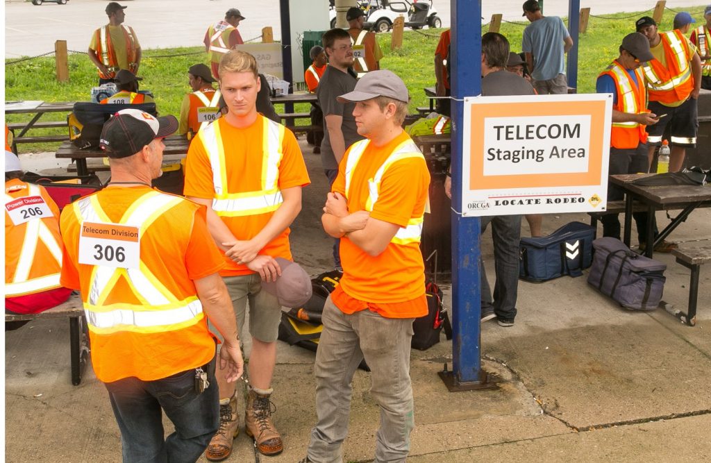 Informative Image showcasing participants socializing at the Telecom Staging Area at the 11th Annual ORCGA Locate Rodeo.