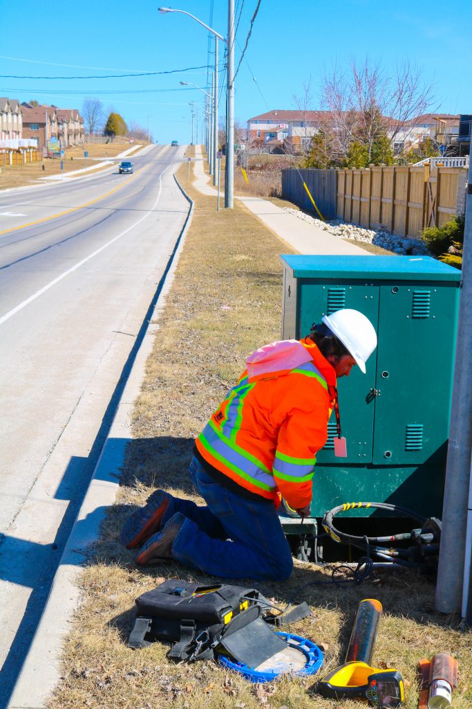 Informative Image of multiVIEW servicing Waterloo region. This photo shows a Cambridge office field technician servicing the City of Kitchner Rogers Utility Locating.